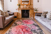 Atlantic Mats recycled rug with pink chrysanthemum design in a rustic living room