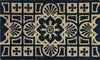 RHS Bloom Coir Collection Gertrude Jekyll Tile doormat with black and tan geometric floral design