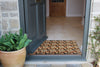Atlantic Mats washable doormat with animal paw prints at a home entrance
