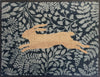 Atlantic Mats washable doormat featuring a golden jumping hare on a navy floral background