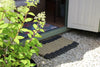 Atlantic Mats extra large recycled rope doormat on white gravel by a doorstep