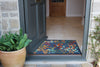 Atlantic Mats washable recycled Midnight Leaves Ocean Mat at an open doorway